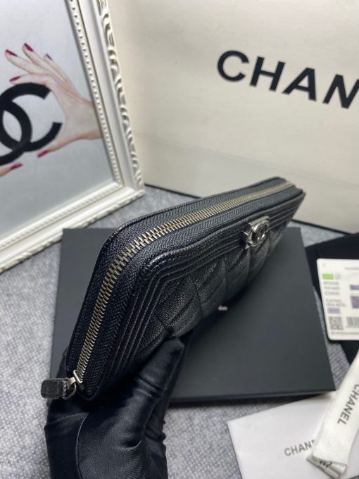 CHANEL 'Boy' Long Zipped Wallet. Original Quality Wallet with literature, dust bag, box and authenticity card. The Chanel 'Boy' Wallets have always been as popular as the Boy Chanel Quilted Bags. Everything about the design resemble to the Boy Bag line including the quilting with stripes on the edges and the boy clasp as well. The calfskin/lambskin makes sure that you don’t need to constantly babying it and it will not get damaged so easily if it sits next to your keys, inside your bag. This wallet is practical and amazing; perfect to hold paper money, credit cards and coins.| CRIS&COCO Authentic Quality Designer Bags and Luxury Accessories