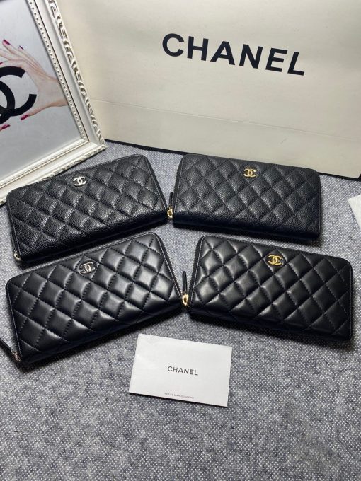 CHANEL Classic Long Zipped Wallet.  Original Quality Wallet including gift box, care book, dust bag, authenticity card. This wallet is one of the signature wallets of Chanel. It has been around for some time now and it will continue to stick around. This wallet is practical and amazing; perfect to hold paper money, credit cards and coins. The classic black color, you will get the signature burgundy colored interior. | CRIS&COCO Authentic Quality Designer Bags and Luxury Accessories