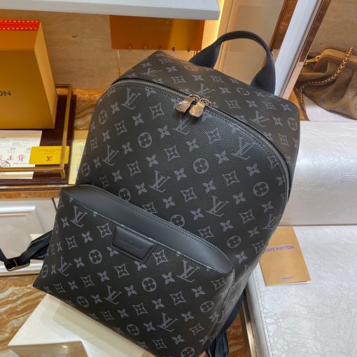 LOUIS VUITTON Discovery Backpack PM. Original Quality Backpack including gift box, care book, dust bag, authenticity card. Perfect for those who want a casual yet sophisticated bag, the Discovery Backpack in supple Monogram Eclipse coated canvas delivers both style and versatility. It boasts distinctive details like an ultra-comfortable leather strap and a front pocket with a magnetic closure. | CRIS&COCO Authentic Quality Designer Bags and Luxury Accessories