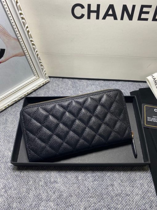 CHANEL Classic Long Zipped Wallet.  Original Quality Wallet including gift box, care book, dust bag, authenticity card. This wallet is one of the signature wallets of Chanel. It has been around for some time now and it will continue to stick around. This wallet is practical and amazing; perfect to hold paper money, credit cards and coins. The classic black color, you will get the signature burgundy colored interior. | CRIS&COCO Authentic Quality Designer Bags and Luxury Accessories