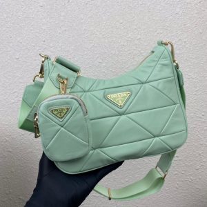 PRADA Padded Shoulder Bag. Authentic quality luxury bag crafted in genuine leather comes with authenticity card, dust bag and gift bag. Patchwork elegance meets functional versatility in this chic leather shoulder bag. This padded leather shoulder bag has a unique triangle-shaped patchwork stitching design, giving it a distinctive look. It features an adjustable logo-print woven nylon shoulder strap for added comfort. The front of the bag is adorned with the iconic enameled metal triangle logo, adding a touch of elegance. Additionally, this versatile accessory comes with a detachable zipper pouch that can be conveniently attached to the shoulder strap.