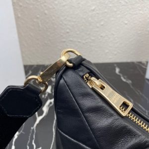PRADA Padded Shoulder Bag. Authentic quality luxury bag crafted in genuine leather comes with authenticity card, dust bag and gift bag. Patchwork elegance meets functional versatility in this chic leather shoulder bag. This padded leather shoulder bag has a unique triangle-shaped patchwork stitching design, giving it a distinctive look. It features an adjustable logo-print woven nylon shoulder strap for added comfort. The front of the bag is adorned with the iconic enameled metal triangle logo, adding a touch of elegance. Additionally, this versatile accessory comes with a detachable zipper pouch that can be conveniently attached to the shoulder strap.