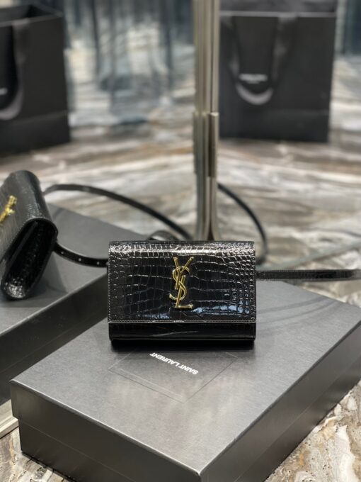 SAINT LAURENT Kate Belt Bag.  Original Quality Bag including gift box, care book, dust bag, authenticity card. Adjustable belt bag with a removable flap pouch and interlacing YSL initials. If you are a fan of an opulent touch, then you'll also be a fan of this logo-plaque belt bag from Saint Laurent. Carry your essentials in style. | CRIS&COCO Authentic Quality Designer Bags and Luxury Accessories