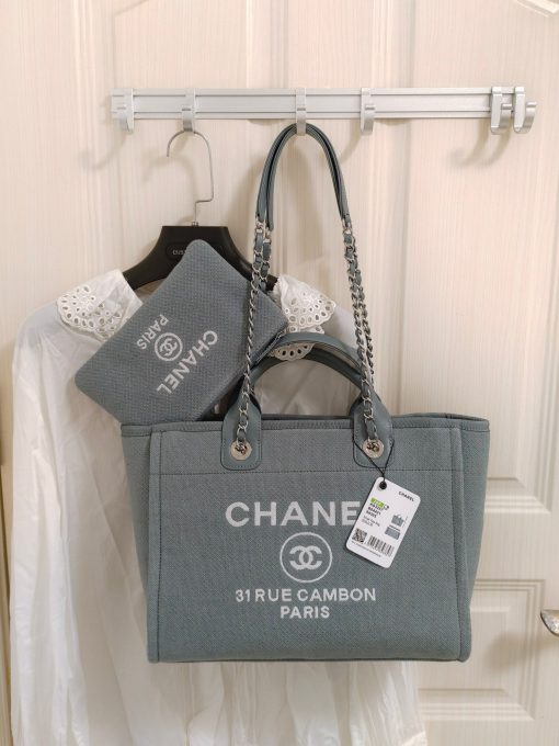 CHANEL Maxi Small Shopping Bag. Original Quality Bag including gift box, care book, dust bag, authenticity card. Luxuriously stylish and chic, this Chanel bag can carry all your essentials and other shopping items. This one is attention grabbing due to its large size and uniquely fun style. The logo comes in white lettering, proudly displaying that it’s a Chanel bag. The interwoven chained shoulder straps and the handles are two practical things you shouldn’t dare miss. Yes, it means you can carry it by the hand or over the shoulder. And just like your high-fashion denim jeans, this new oversized bag is made from denim, which means its durable, strong and easy to maintain. | CRIS&COCO Authentic Quality Designer Bag and Luxury Accessories