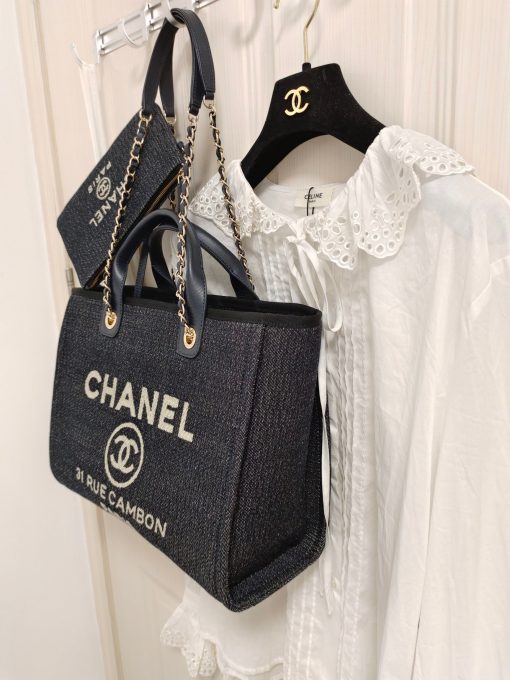 CHANEL Maxi Small Shopping Bag. Original Quality Bag including gift box, care book, dust bag, authenticity card. Luxuriously stylish and chic, this Chanel bag can carry all your essentials and other shopping items. This one is attention grabbing due to its large size and uniquely fun style. The logo comes in white lettering, proudly displaying that it’s a Chanel bag. The interwoven chained shoulder straps and the handles are two practical things you shouldn’t dare miss. Yes, it means you can carry it by the hand or over the shoulder. And just like your high-fashion denim jeans, this new oversized bag is made from denim, which means its durable, strong and easy to maintain. | CRIS&COCO Authentic Quality Designer Bag and Luxury Accessories