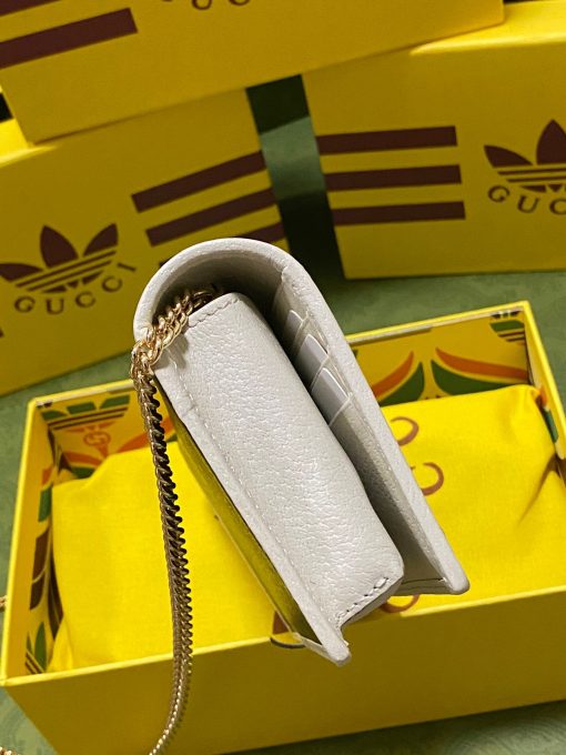 GUCCI X ADIDAS Wallet With Chain.  Original Quality Wallet including gift box, care book, dust bag, authenticity card. Part of the GUCCI X ADIDAS collection, this chain wallet features the Gucci Trefoil print. Emblematic House’s motifs mix with those of the historic sportswear brand adidas. The collection sees both heritages encoded in a trio of lines, where adidas and Gucci combine archival emblems. Creative Director, Alessandro Michele pulls inspiration from his memories of the ‘80s and ‘90s for a collection that is both nostalgia-driven and contemporary. | CRIS&COCO Authentic Quality Designer Bag and Luxury Accessories