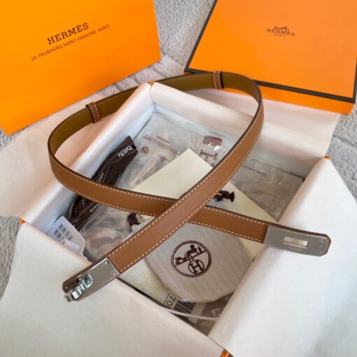 HERMÈS Kelly 18 Belt. Original Quality Belt including gift box, care book, dust bag, authenticity card. The variations of these one size fits all belts change the ways in which they can be worn by adjusting to all sizes while reinterpreting classic Hermes pieces with clever jewel clasps. Thanks to the clever sliding system, this one-size-fits-most belt may be worn at the waist or on the hips. | CRIS&COCO Authentic Quality Designer Bag and Luxury Accessories