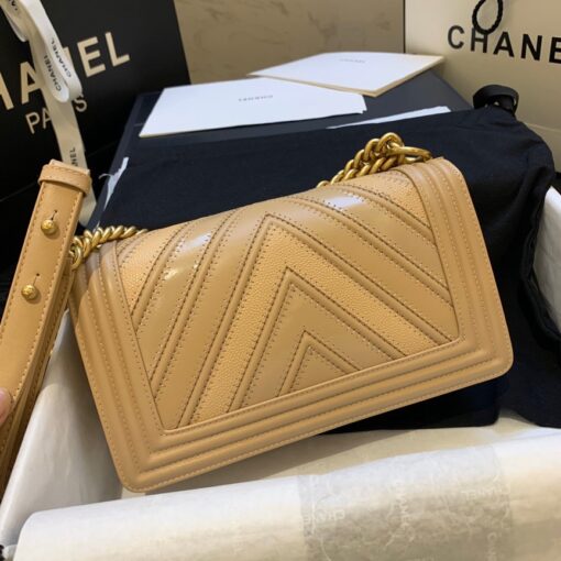 CHANEL Medium Chevron Mix Leather Boy Bag. Original Quality Bag including gift box, care book, dust bag, authenticity card. Chanel introduces a new style for their iconic Boy Bag. For the brand’s Spring/Summer 2016 Collection, this Boy Bag comes in a mix of three different leathers: Calfskin, Suede Calfskin and Grained Calfskin. A handle-chain in gilded metal allowing a carried hand or shoulder. This is a marvelous shoulder bag for day or evening and just the essentials, from Chanel! | CRIS&COCO Authentic Quality Designer Bag and Luxury Accessories