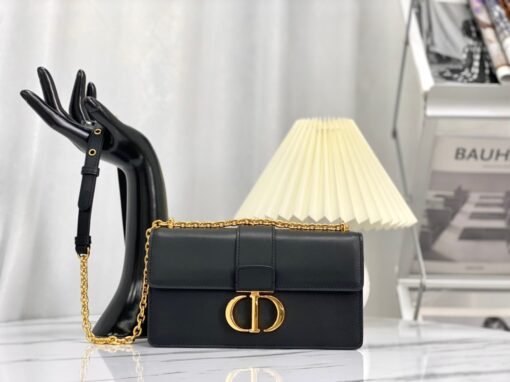 DIOR 30 Montaigne East-West Bag With Chain. Original Quality Bag including gift box, care book, dust bag, authenticity card. The East-West bag with chain enhances the 30 Montaigne line with a timeless and elegant design crafted in ultra-smooth calfskin. The flap has an antique gold-finish metal CD clasp, inspired by the seal of a Christian Dior perfume bottle. Other details, like the embossed 30 Montaigne signature on the back, highlight the streamlined design. The bag features a removable chain strap with a leather insert that allows it to be comfortably carried by hand, worn over the shoulder or crossbody. | CRIS&COCO Authentic Quality Designer Bag and Luxury Accessories