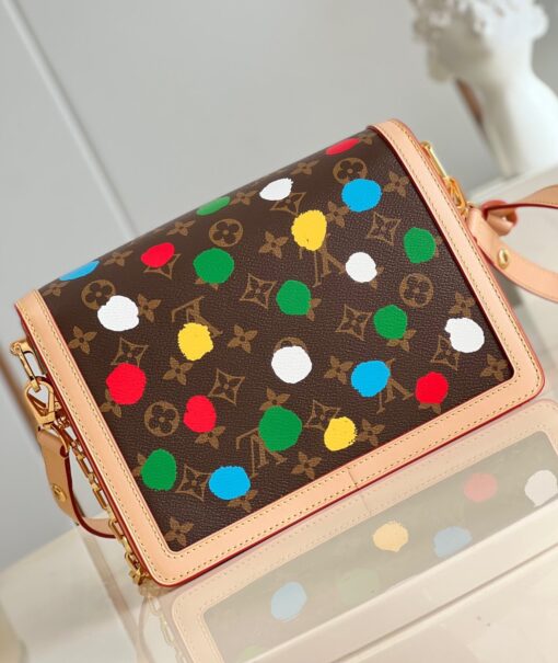 LOUIS VUITTON X Yayoi Kusama Dauphine MM. Original Quality Bag including gift box, care book, dust bag, authenticity card. The LVxYK Dauphine MM joins the “Painted Dots” theme as part of the exclusive Louis Vuitton x Yayoi Kusama collection. The venerable Japanese artist is known for her use of dots, an emblematic motif for her since childhood. In this version of the Dauphine, rainbow-colored dots adorn Monogram canvas, screen-printed with a 3D hand-painted effect. A high-spirited new look that brings fresh creative energy to a classic bag. | CRIS&COCO Authentic Quality Designer Bag and Luxury Accessories