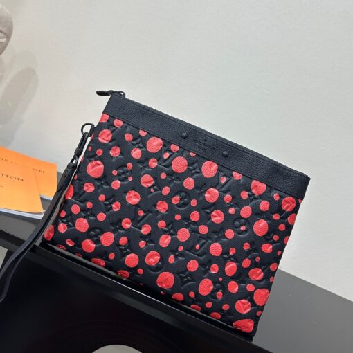 LOUIS VUITTON X Yayoi Kusama Pochette To Go. Original Quality Bag including gift box, care book, dust bag, authenticity card. It’s the renewal of a close creative collaboration: for the second Louis Vuitton x Yayoi Kusama collection, the LVxYK Pochette To Go features a striking new print inspired by the renowned Japanese artist’s obsession with dotted motifs. Dazzling red dots are arrayed on black Taurillon cowhide embossed with the House’s heritage Monogram pattern. A joyful symbol of infinity that turns this practical travel pouch into an artistic collector’s item. | CRIS&COCO Authentic Quality Designer Bag and Luxury Accessories