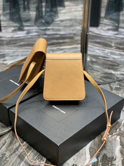 SAINT LAURENT Kaia North/South Shoulder Bag. Original Quality Bag including gift box, care book, dust bag, authenticity card. Saint Laurent's Kaia shoulder bag is named after model Kaia Gerber and was first introduced during the SS20 collection. Finished with refined gold-tone details, this elongated North/South iteration fastens with a magnetic closure and can be worn across the body or on the shoulder thanks to its adjustable strap. | CRIS&COCO Authentic Quality Designer Bags and Luxury Accessories