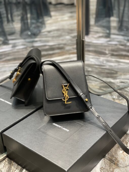 SAINT LAURENT Kaia North/South Shoulder Bag. Original Quality Bag including gift box, care book, dust bag, authenticity card. Saint Laurent's Kaia shoulder bag is named after model Kaia Gerber and was first introduced during the SS20 collection. Finished with refined gold-tone details, this elongated North/South iteration fastens with a magnetic closure and can be worn across the body or on the shoulder thanks to its adjustable strap. | CRIS&COCO Authentic Quality Designer Bags and Luxury Accessories