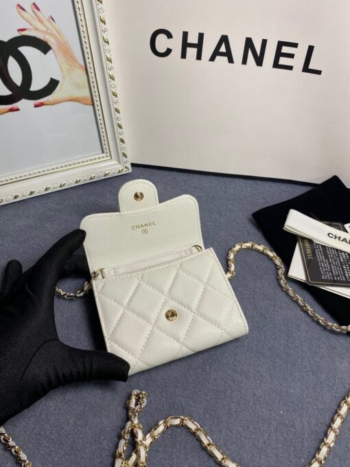 CHANEL Classic Mini Clutch With Chain. Original Quality Bag including gift box, care book, dust bag, authenticity card. The Chanel Classic Mini Clutch is the true authentic beauty because it resembles the Classic Flap Bag. It’s also the mini version of the Clutch With Chain Bag. This Mini Clutch is really tiny. But tiny has its advantage because it can be used in numerous ways. Especially this handbag as it comes with a long chain for shoulder carry. This one can be used as an extra wallet inside your bag. At night it can be carried as an adorable evening accessory. | CRIS&COCO Authentic Quality Designer Bags and Luxury Accessories