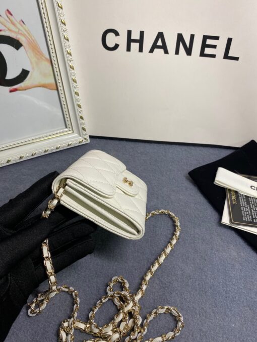 CHANEL Classic Mini Clutch With Chain. Original Quality Bag including gift box, care book, dust bag, authenticity card. The Chanel Classic Mini Clutch is the true authentic beauty because it resembles the Classic Flap Bag. It’s also the mini version of the Clutch With Chain Bag. This Mini Clutch is really tiny. But tiny has its advantage because it can be used in numerous ways. Especially this handbag as it comes with a long chain for shoulder carry. This one can be used as an extra wallet inside your bag. At night it can be carried as an adorable evening accessory. | CRIS&COCO Authentic Quality Designer Bags and Luxury Accessories