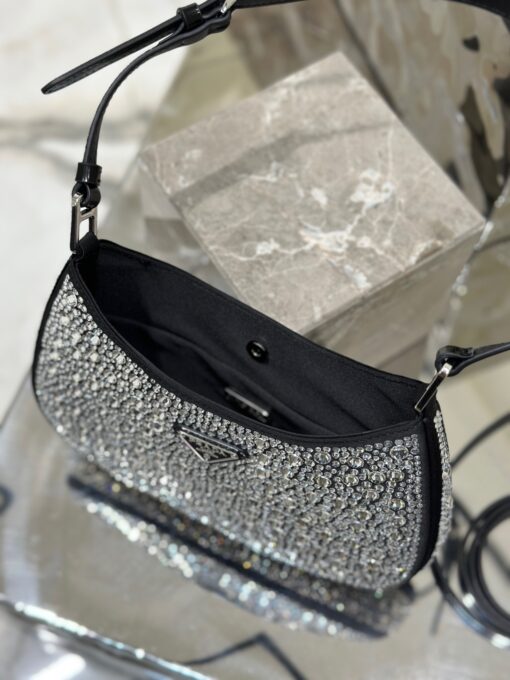 PRADA Cleo Satin Bag With Crystals. Original Quality Bag including gift box, care book, dust bag, authenticity card. Feminine, elegant and modern, the Prada Cleo bag is made of satin and embellished with luminous crystals of different sizes that give the bag refined charm. The sinuous shape that recalls archive styles makes the accessory iconic. | CRIS&COCO Authentic Quality Designer Bags and Luxury Accessories