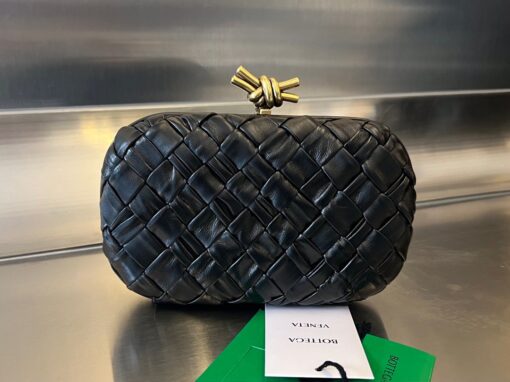 BOTTEGA VENETA Knot Clutch. Original Quality Bag including gift box, care book, dust bag, authenticity card. Bottega Veneta's intrecciato technique has rapidly become a signature style code of the Italian brand since its founding in 1966, amassing fans from across the globe. This leather clutch features a contemporary update in the form of a knot. Wear yours with vibrant outfits. | CRIS&COCO Authentic Quality Designer Bags and Luxury Accessories