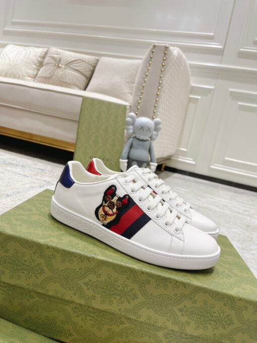GUCCI Sneaker. Original Quality Sneaker including gift box, care book, dust bag, authenticity card. The classic low-top sneaker in leather with Web detail. These are so great that they would soon become a part of your every day wardrobe. | CRIS&COCO Authentic Quality Designer Bags and Luxury Accessories