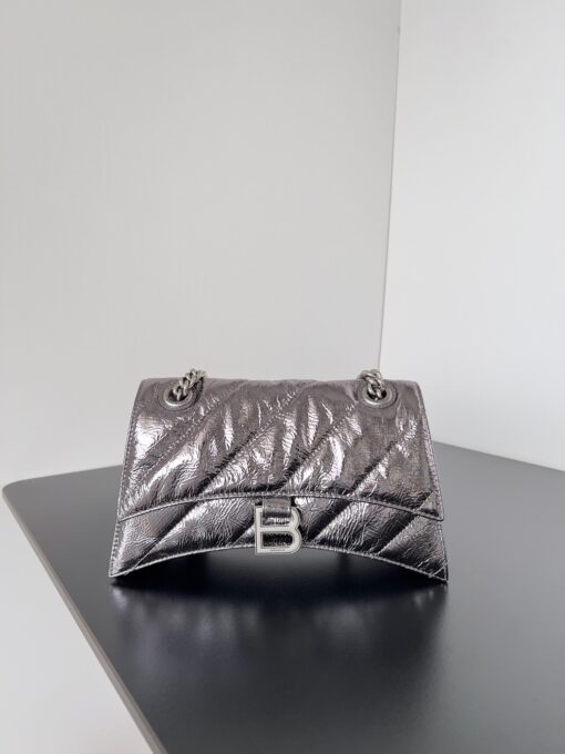 BALENCIAGA Crush Small Chain Bag. Original Quality Bag including gift box, care book, dust bag, authenticity card. Crush on this metallic Crush Chain Bag. This is a new iteration on their celebrated curvilinear design, complete with tonal B logo hardware and shoulder and crossbody chain. Crafted in a contemporary crushed quilted calfskin. | CRIS&COCO Authentic Quality Designer Bags and Luxury Accessories