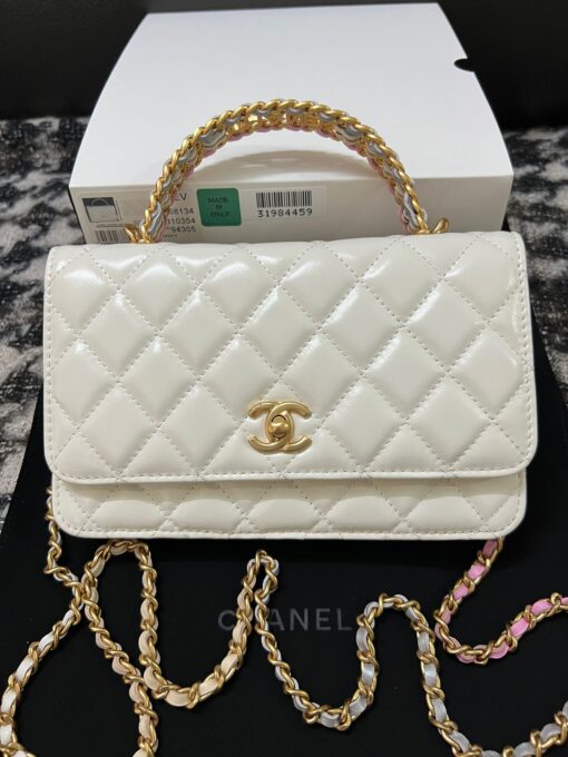 CHANEL Wallet On Chain With Signature Handle. Original Quality Bag including gift box, care book, dust bag, authenticity card. This is a seasonal bag from the Chanel Spring Summer 2022 SLG Collection. The design itself is so special about it. This bag is made with calfskin in diamond quilting. Then the center is refined with a vintage golden CC logo. The signature handle on the top to joints the woven leather strap. This bag comes with a back-pocket and a main compartment with card holders and chain pocket. | CRIS&COCO Authentic Quality Designer Bags and Luxury Accessories