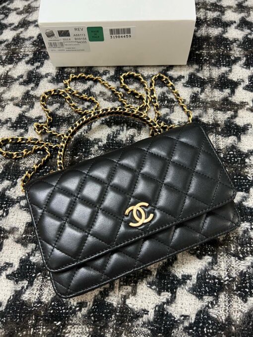 CHANEL Wallet On Chain With Signature Handle. Original Quality Bag including gift box, care book, dust bag, authenticity card. This is a seasonal bag from the Chanel Spring Summer 2022 SLG Collection. The design itself is so special about it. This bag is made with calfskin in diamond quilting. Then the center is refined with a vintage golden CC logo. The signature handle on the top to joints the woven leather strap. This bag comes with a back-pocket and a main compartment with card holders and chain pocket. | CRIS&COCO Authentic Quality Designer Bags and Luxury Accessories