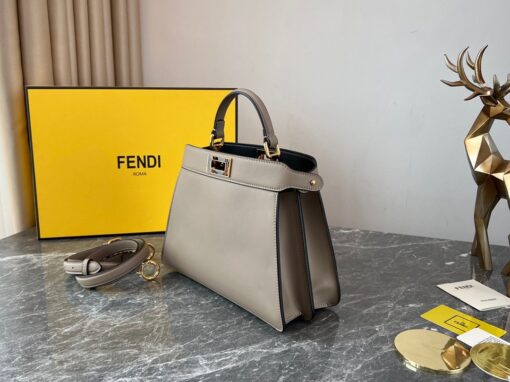 FENDI Peekaboo Iseeu Small. Original Quality Bag including gift box, care book, dust bag, authenticity card. Small, iconic Peekaboo ISeeU bag made of leather and embellished with the classic twist lock on both sides. The bag can be carried by hand or worn either on the shoulder or cross-body thanks to the handle and adjustable, detachable shoulder strap. | CRIS&COCO Authentic Quality Designer Bags and Luxury Accessories