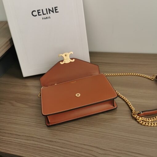 CELINE Wallet On Chain Triomphe. Original Quality Bag including gift box, care book, dust bag, authenticity card. Looking for a reasonable priced high fashion WOC. Take a look at this latest Celine Wallet On Chain from the Spring Summer 2021 Collection. Made from calfskin, this WOC is made for flaunting. The center comes with the famous Triomphe CC logo. There are different colors available, but the bag comes with a chain colored in gold hardware. The chain can also be removed so you can turn it into an evening clutch. You also get a shoulder pad. | CRIS&COCO Authentic Quality Designer Bags and Luxury Accessories