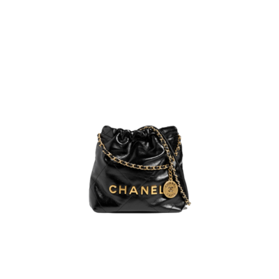 CHANEL 22 Mini Handbag. Original Quality Bag including gift box, care book, dust bag, authenticity card. The Chanel 22 Handbag, has a shape, versatility, and buzz all its own, bringing a casual, even bohemian flare to the always-dressed fashion house. This is crafted of diamond-stitched calfskin leather. The bag features leather threaded silver chain shoulder straps and a matching Chanel logo on the front. The open top with magnetic closure leads to a black fabric interior with a zipper pocket and a removable pouch. | CRIS AND COCO Authentic Quality Luxury Accessories