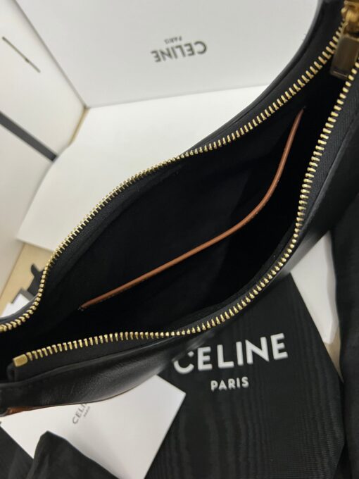 CELINE Medium Ava Strap Bag. High-End Quality Bag including gift box, care book, dust bag, authenticity card. Celine's Ava bag is a perfect example of the brand's signature style, with powerful understated elegance. Crafted from a variety of materials, including iconic leather and textiles with the stylish Celine logo plastering the surface, the bag is a classic with a hint of '80s-inspired blouson. Taking inspiration from the iconic Arc de Triomphe, the logo features two opposites-facing Cs and a patterned center. The minimalist aesthetic of the new logo and colors perfectly encapsulates the essence of the brand. The semi-moon silhouette and adjustable shoulder straps allows the bag to be styled any number of ways, making it perfect for someone who carries minimal items on a daily basis without needing a crossbody strap. With enough room for the essentials, the Celine Ava bag is an ultimate cool-girl essential. | CRIS AND COCO Authentic Quality Luxury Accessories