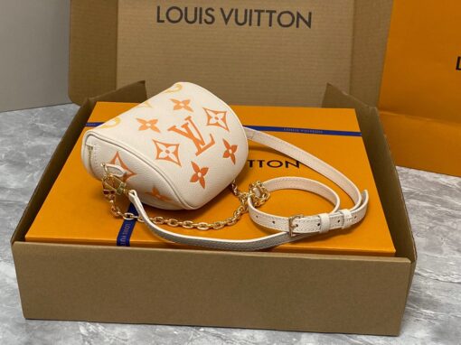 LOUIS VUITTON Mini Bumbag. High-End Quality Bag including gift box, care book, dust bag, authenticity card. Part of Louis Vuitton's Gradient Collection, the Mini Bumbag is an elegant take on the on-trend bag format. Crafted from Monogram Empreinte leather with a stunning printed gradation of colors, this bag will make a stylish addition to your accessory wardrobe. It features a zipped main compartment with a front pocket adorned with a Louis Vuitton leather tag as well as adjustable, removable straps that you can use for either cross-body or shoulder wear. This Mini Bumbag also comes with a stylish, gold-tone chain making it the perfect accessory for any summer occasion. | CRIS AND COCO Authentic Quality Luxury Accessories