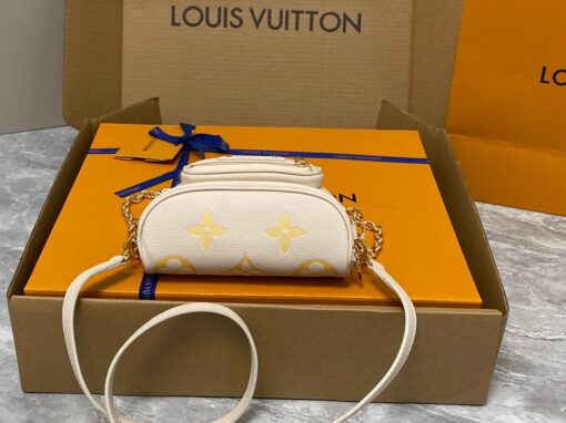 LOUIS VUITTON Mini Bumbag. High-End Quality Bag including gift box, care book, dust bag, authenticity card. Part of Louis Vuitton's Gradient Collection, the Mini Bumbag is an elegant take on the on-trend bag format. Crafted from Monogram Empreinte leather with a stunning printed gradation of colors, this bag will make a stylish addition to your accessory wardrobe. It features a zipped main compartment with a front pocket adorned with a Louis Vuitton leather tag as well as adjustable, removable straps that you can use for either cross-body or shoulder wear. This Mini Bumbag also comes with a stylish, gold-tone chain making it the perfect accessory for any summer occasion. | CRIS AND COCO Authentic Quality Luxury Accessories