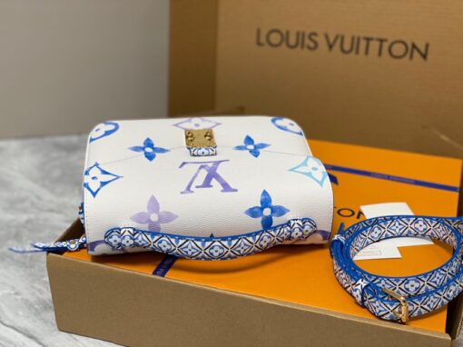 LOUIS VUITTON Pochette Métis MM. Style with a Portuguese Touch. This exquisite Pochette Metis handbag is crafted from cream-colored canvas and highlighted by pastel LV's and Monogram Flowers printed with a watercolor-like effect. The top handle and detachable strap present a more prominent Monogram Flower pattern, reminiscent of the Portuguese painted ceramic tilework. | CRIS&COCO Authentic Quality Designer Bags and Luxury Accessories