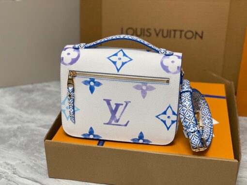 LOUIS VUITTON Pochette Métis MM. Style with a Portuguese Touch. This exquisite Pochette Metis handbag is crafted from cream-colored canvas and highlighted by pastel LV's and Monogram Flowers printed with a watercolor-like effect. The top handle and detachable strap present a more prominent Monogram Flower pattern, reminiscent of the Portuguese painted ceramic tilework. | CRIS&COCO Authentic Quality Designer Bags and Luxury Accessories