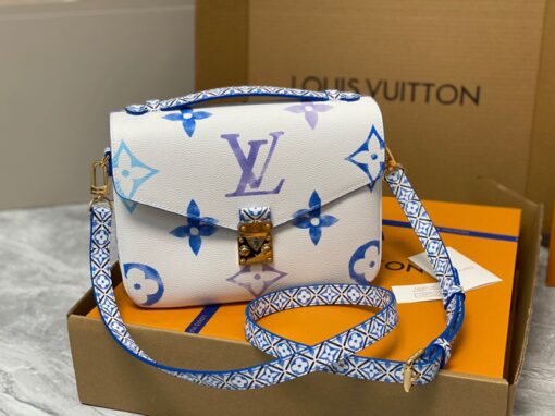 LOUIS VUITTON Pochette Métis MM. Style with a Portuguese Touch. This exquisite Pochette Metis handbag is crafted from cream-colored canvas and highlighted by pastel LV's and Monogram Flowers printed with a watercolor-like effect. The top handle and detachable strap present a more prominent Monogram Flower pattern, reminiscent of the Portuguese painted ceramic tilework. | CRIS&COCO Authentic Quality Designer Bags and Luxury Accessories