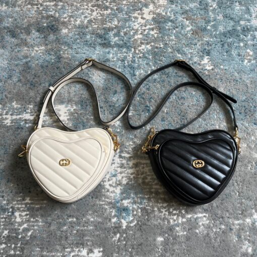 GUCCI Interlocking G Mini Heart Shoulder Bag. Timeless Heritage meets Playful Charm. The Interlocking G pattern beautifully blends nostalgia and contemporary influences. Crafted with diagonal matelassé leather, this mini shoulder bag showcases a delightful concentric heart-shaped design, adding a whimsical touch. | CRIS&COCO Authentic Quality Designer Bags and Luxury Accessories