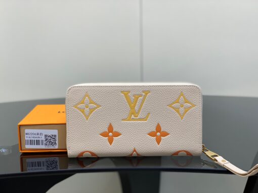 LOUIS VUITTON Zippy Wallet – Where Luxury Meets Functionality. Presenting the exquisite Zippy wallet, a coveted piece from the LV Gradient collection for this season. Meticulously fashioned using grained, embossed Monogram Empreinte leather, it showcases a gracefully transitioning spectrum of summery hues. This iconic wallet is distinguished by its sleek, slender profile, dependable zip closure, and ingeniously designed interior replete with an array of card slots, pockets, and compartments, ensuring both style and functionality in one harmonious package. | CRIS&COCO Authentic Quality Designer Bags and Luxury Accessories