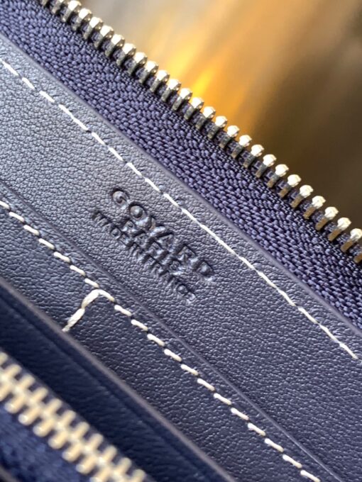 GOYARD Matignon GM Wallet: A Statement of Elegance and Functionality. Experience luxury and functionality with the Goyard Matignon GM Wallet. Crafted from premium calf leather and Goyardine canvas, it offers twelve card slots, a zipper pocket, and two spacious compartments, all secured by a snap button closure. Handcrafted by skilled artisans, Whether you're running errands or gracing a formal occasion, this wallet is the ultimate style companion. Choose from an array of colors to reflect your personality and elevate your ensemble. With this wallet, you'll not only radiate elegance but also experience unparalleled functionality. | CRIS&COCO Authentic Quality Designer Bags and Luxury Accessories
