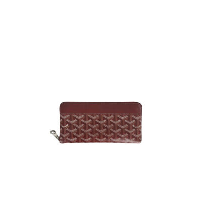 GOYARD Matignon GM Wallet: A Statement of Elegance and Functionality. Experience luxury and functionality with the Goyard Matignon GM Wallet. Crafted from premium calf leather and Goyardine canvas, it offers twelve card slots, a zipper pocket, and two spacious compartments, all secured by a snap button closure. Handcrafted by skilled artisans, Whether you're running errands or gracing a formal occasion, this wallet is the ultimate style companion. Choose from an array of colors to reflect your personality and elevate your ensemble. With this wallet, you'll not only radiate elegance but also experience unparalleled functionality. | CRIS&COCO Authentic Quality Designer Bags and Luxury Accessories