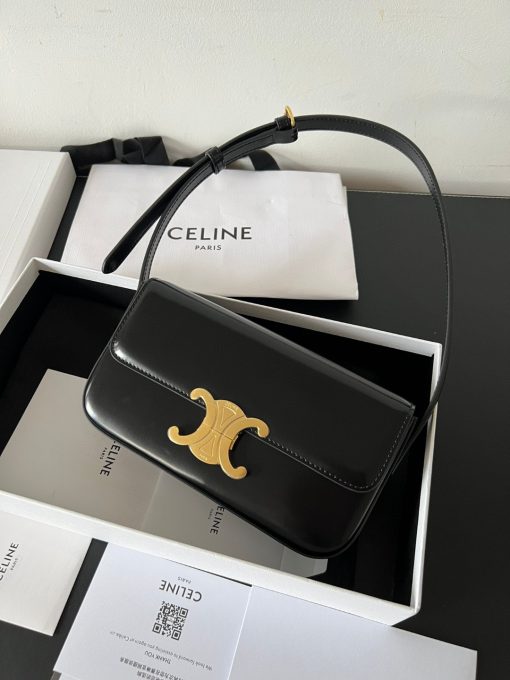 CELINE Claude Shoulder Bag. Elegance Unveiled: Embrace Timeless Luxury Every Day. The bag boasts a beautifully minimalist design, with the spotlight shining on its exquisite leather craftsmanship. Its center is adorned with the elegant Triomphe Metallic Closure in gleaming gold hardware, where the iconic double C symbolizes Celine's timeless style. Meticulously crafted from durable and robust calfskin leather, this versatile bag effortlessly transitions from special occasions to everyday wear, making it a chic and functional choice for any setting, including the workplace.