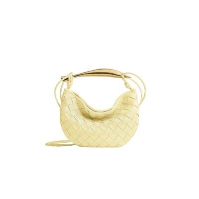 BOTTEGA VENETA Mini Sardine. Crafted to Perfection, Inspired by Nature: Your Timeless Companion for All Occasions. Bottega Veneta's masterful intrecciato weaving technique was originally crafted to ensure the enduring quality of leather goods. The Sardine Mini leather shoulder bag, meticulously fashioned from supple lamb leather, showcases a distinctive top handle reminiscent of a graceful fish. This versatile piece seamlessly transitions from day to night, making it the perfect, reliable companion to elegantly accommodate all your essentials.