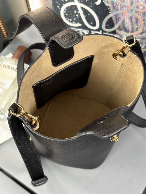 LOEWE Pebble Bucket Mini bag in soft grained calfskin with adjustable Anagram Pebble strap.