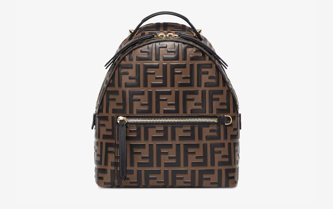 Elegant luxury backpack displayed in a plain setting, including the FENDI FF Backpack.