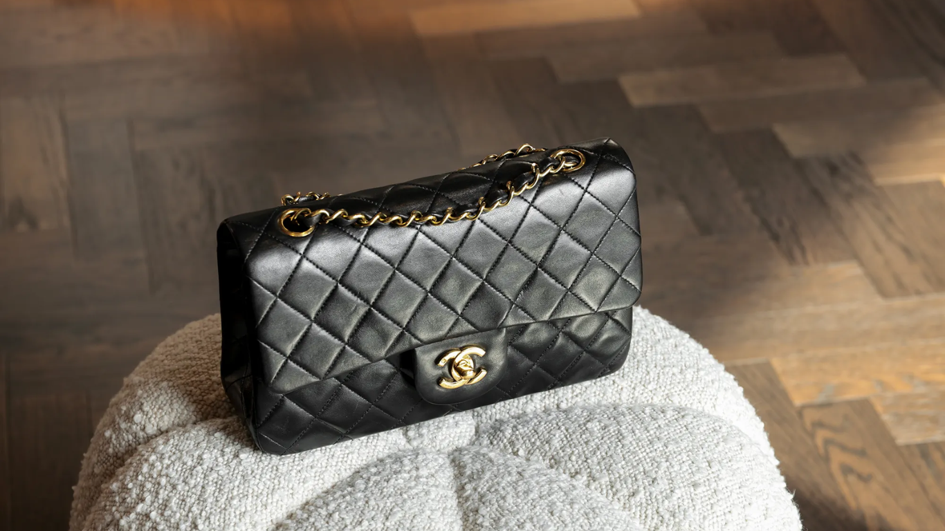 A collection of Chanel Flap Bags in various sizes and colors.