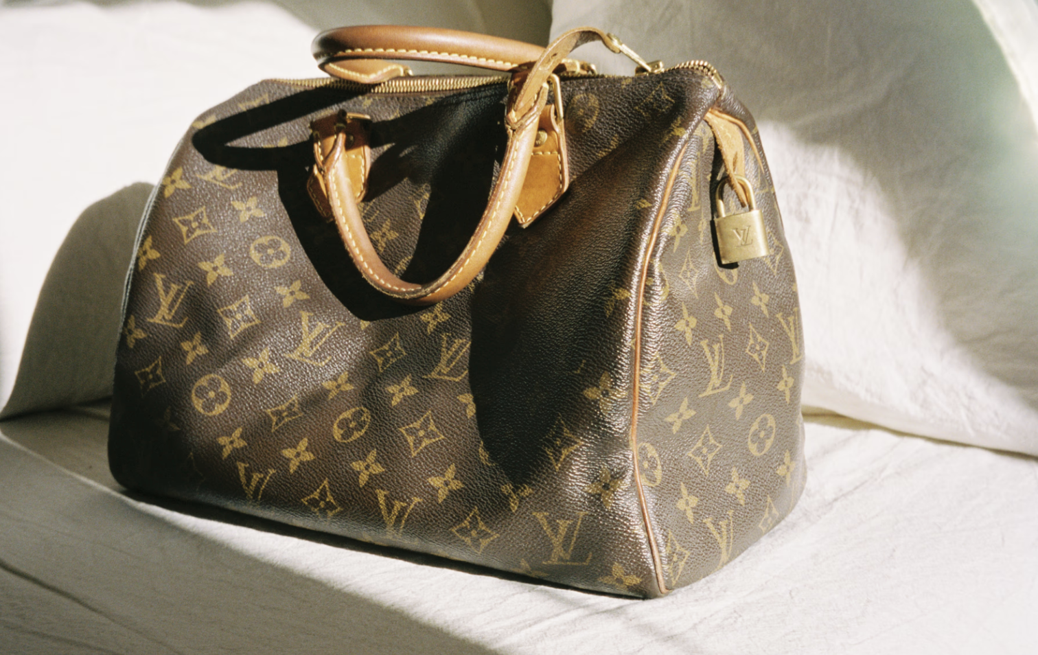 LOUIS VUITTON monogrammed bag showcasing timeless luxury and craftsmanship.