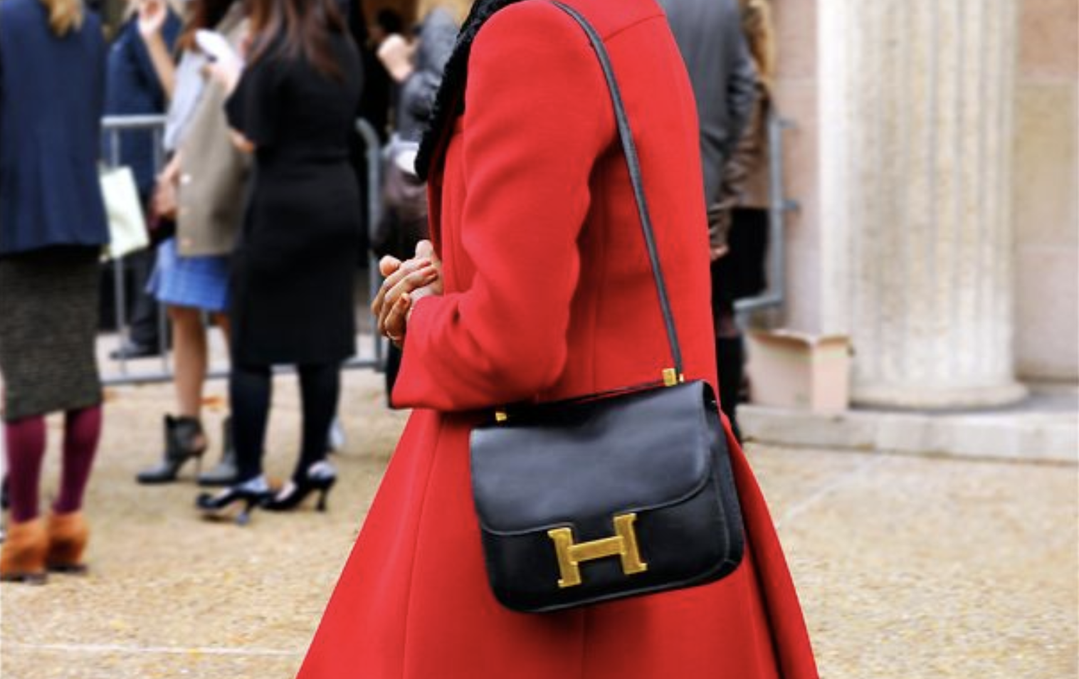 Hermès Constance bag worn crossbody with a casual chic ensemble.