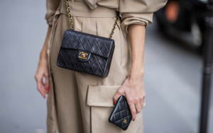 Close-up of a black quilted Chanel Classic Flap Bag with gold hardware