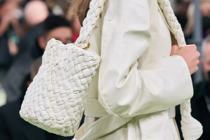 A chic scene showcasing a fashion enthusiast exploring luxury vintage bags.