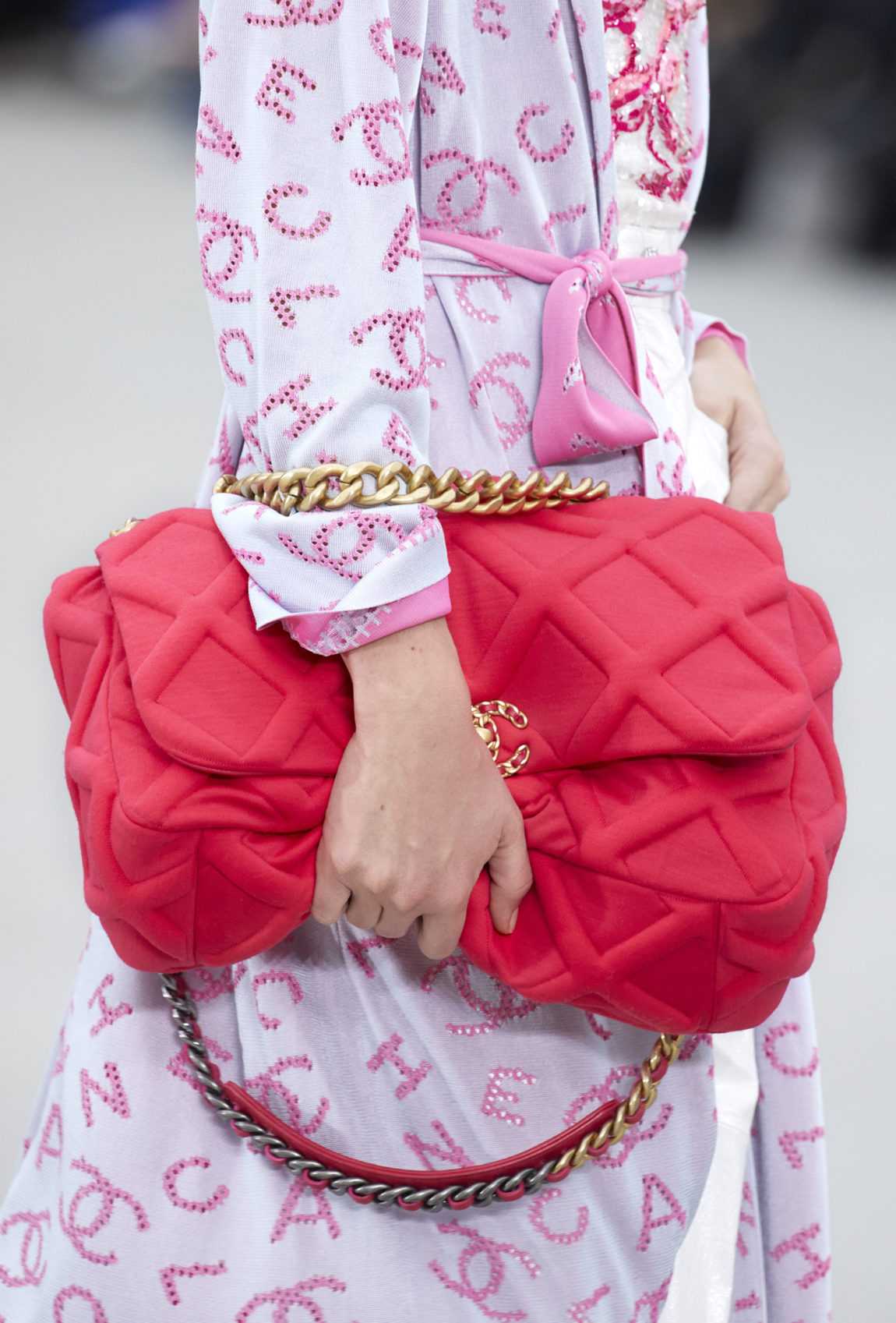 CHANEL 19 Flap Bag showcased on a modern PRADA runway