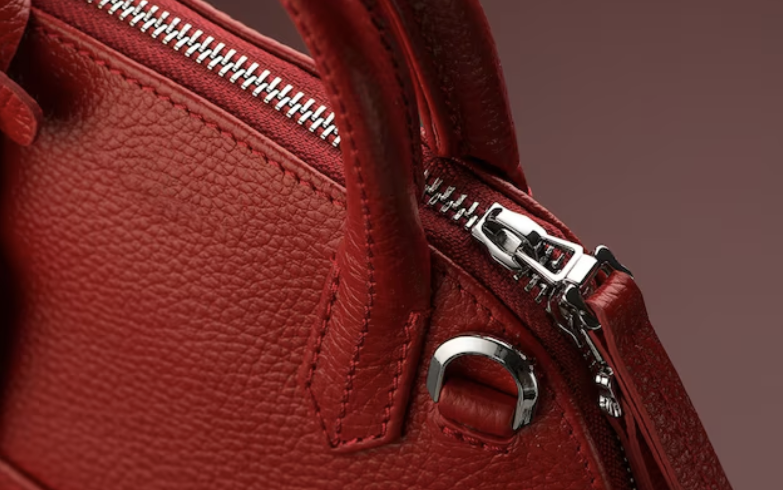 Detailed view of a counterfeit luxury bag showcasing subtle differences with an authentic bag.