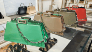 A detailed look at a FENDI PEEKABOO CUT replica bag, sparkling under sunlight.
